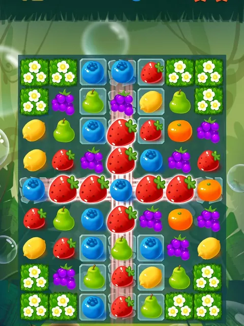 A Sweet Fruit Candy level with strawberries, pears, blueberries and grapes arranged on a green flowered board.